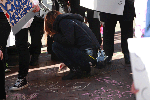 Right to the City Boston Homes for All protest included chalk messages on sidewalks. (Image courtesy of Martinez.E.)